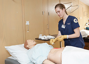 A nursing student in a lab on the Marquette campus