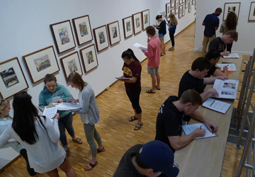 Students in the Haggerty Museum of Art use art to complete an assignment