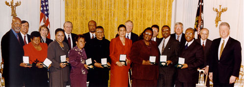 Little Rock Nine with President Bill Clinton after receiving their awards
