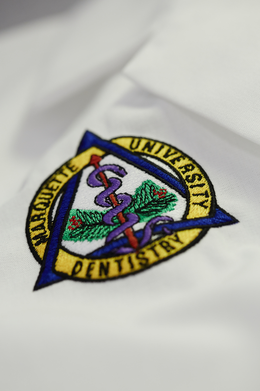 Dental School logo on lab coat