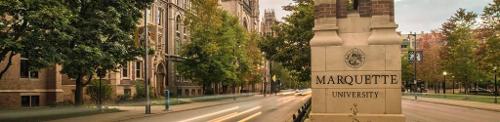 Marquette pillar in the middle of Wisconsin Ave.