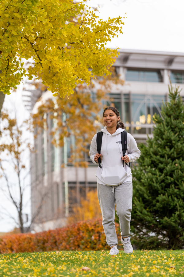 student walks around marquette campus