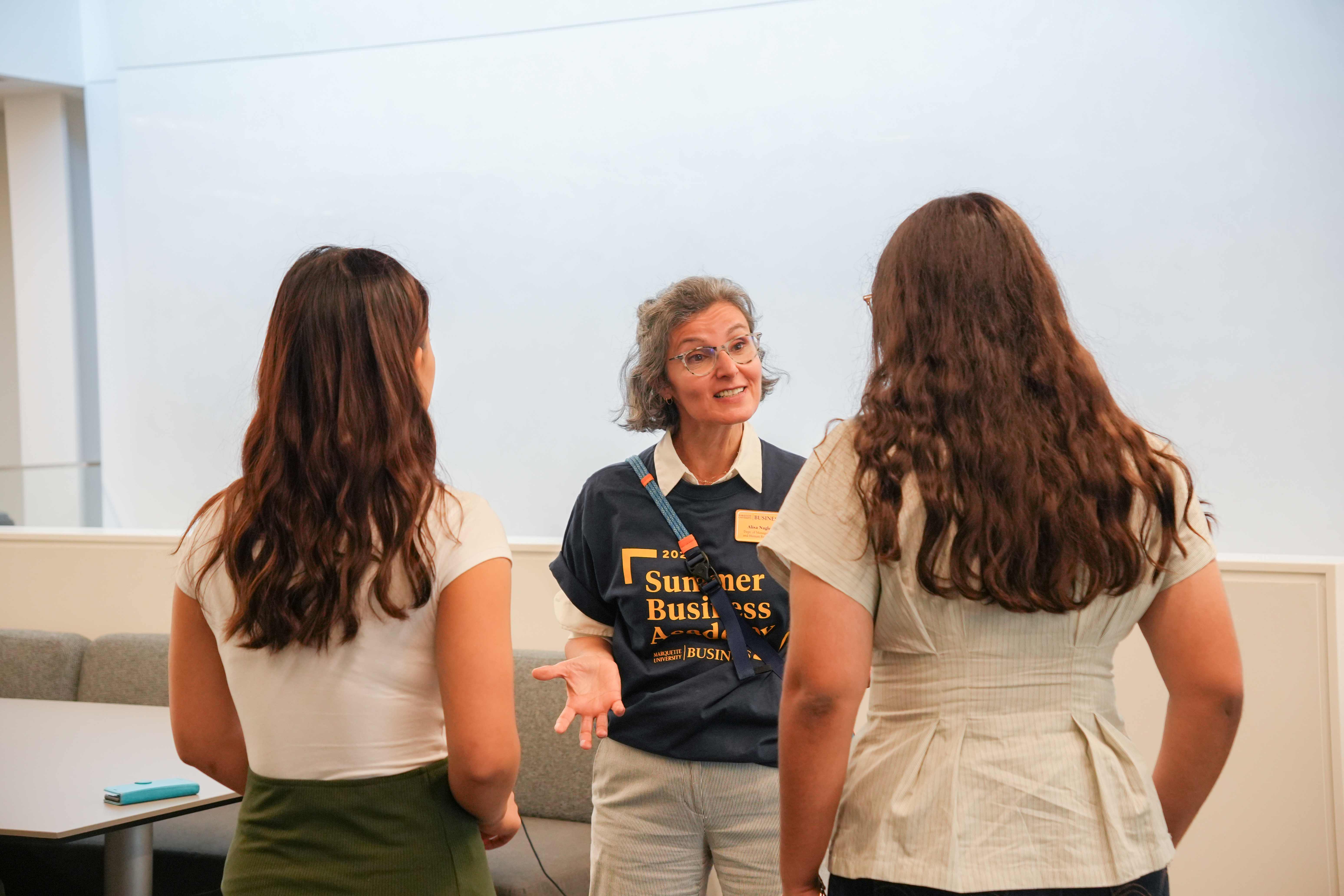 students talk with professor
