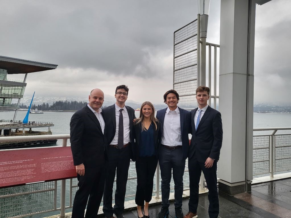Four finance students stand together in Vancouver.