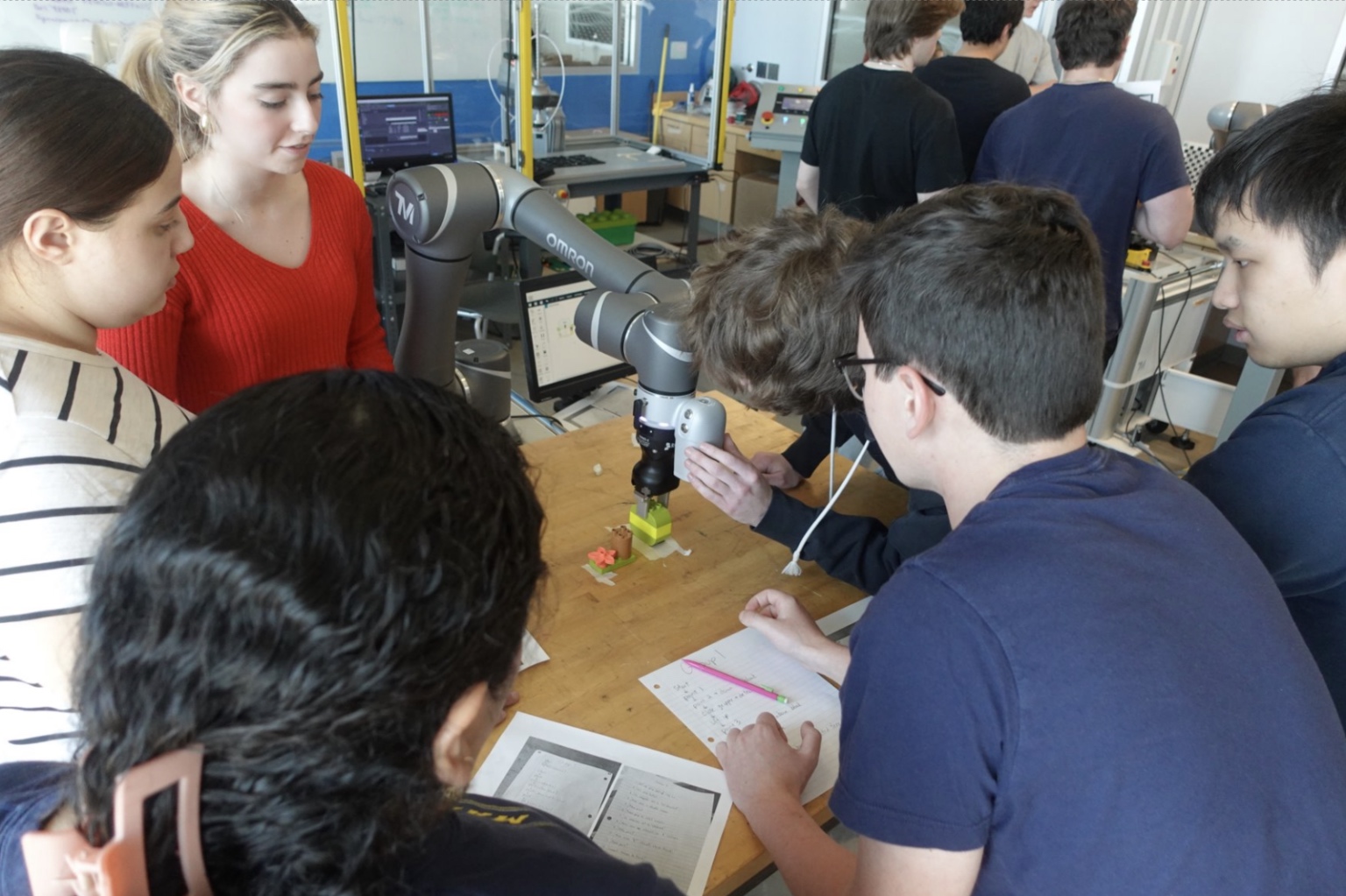 A group of supply chain students in the OMRON Laboratory