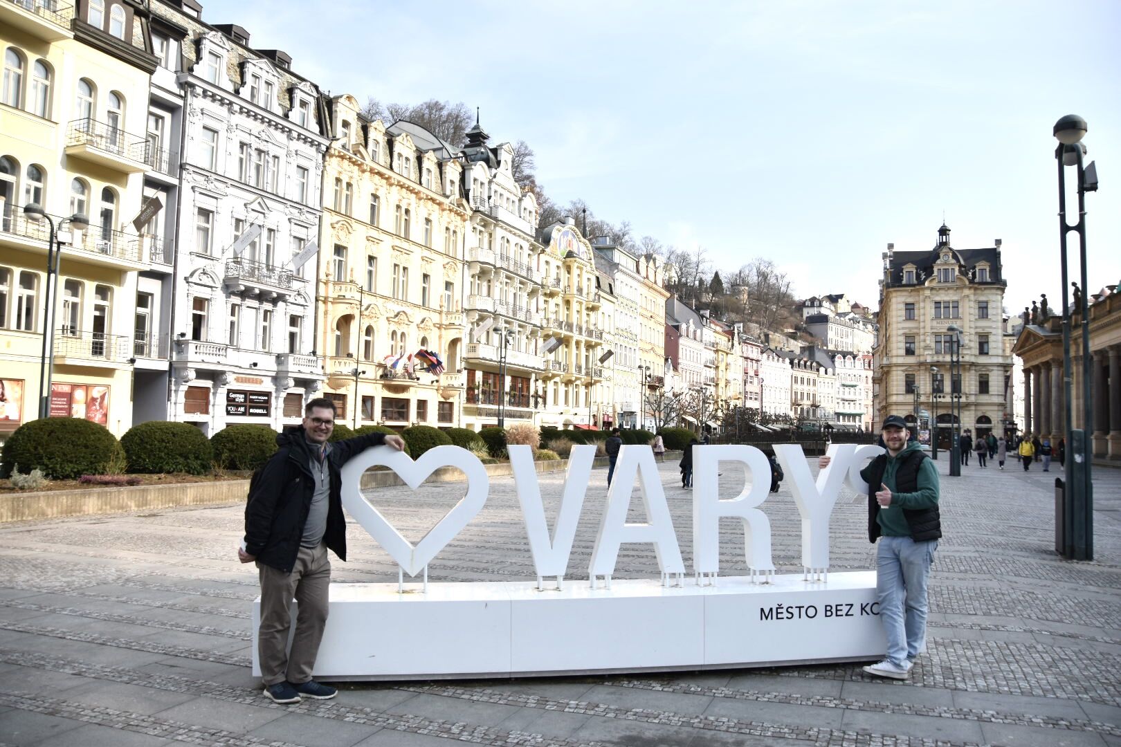 A faculty member and a student pose in Karlovy Vary, a spa town in Czechia.