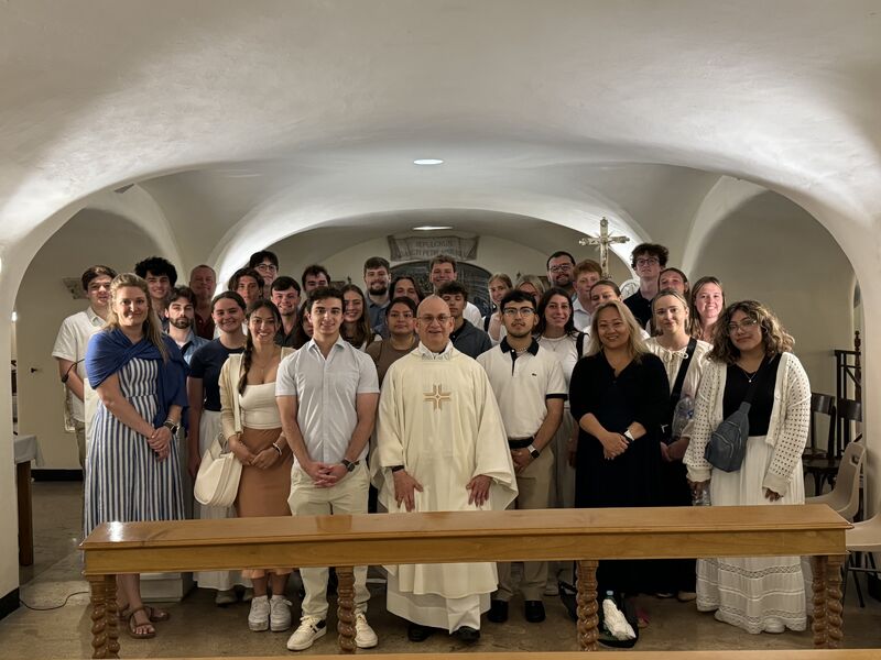 Thirty Marquette students pose in St. Peter's Basilica.