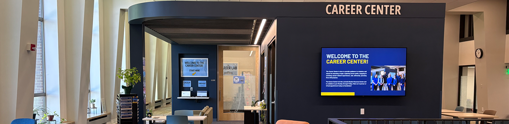A photo of Marquette University's Lemonis Center of Student Success on the fourth floor facing the student waiting area in front of some of the Career Center's offices 