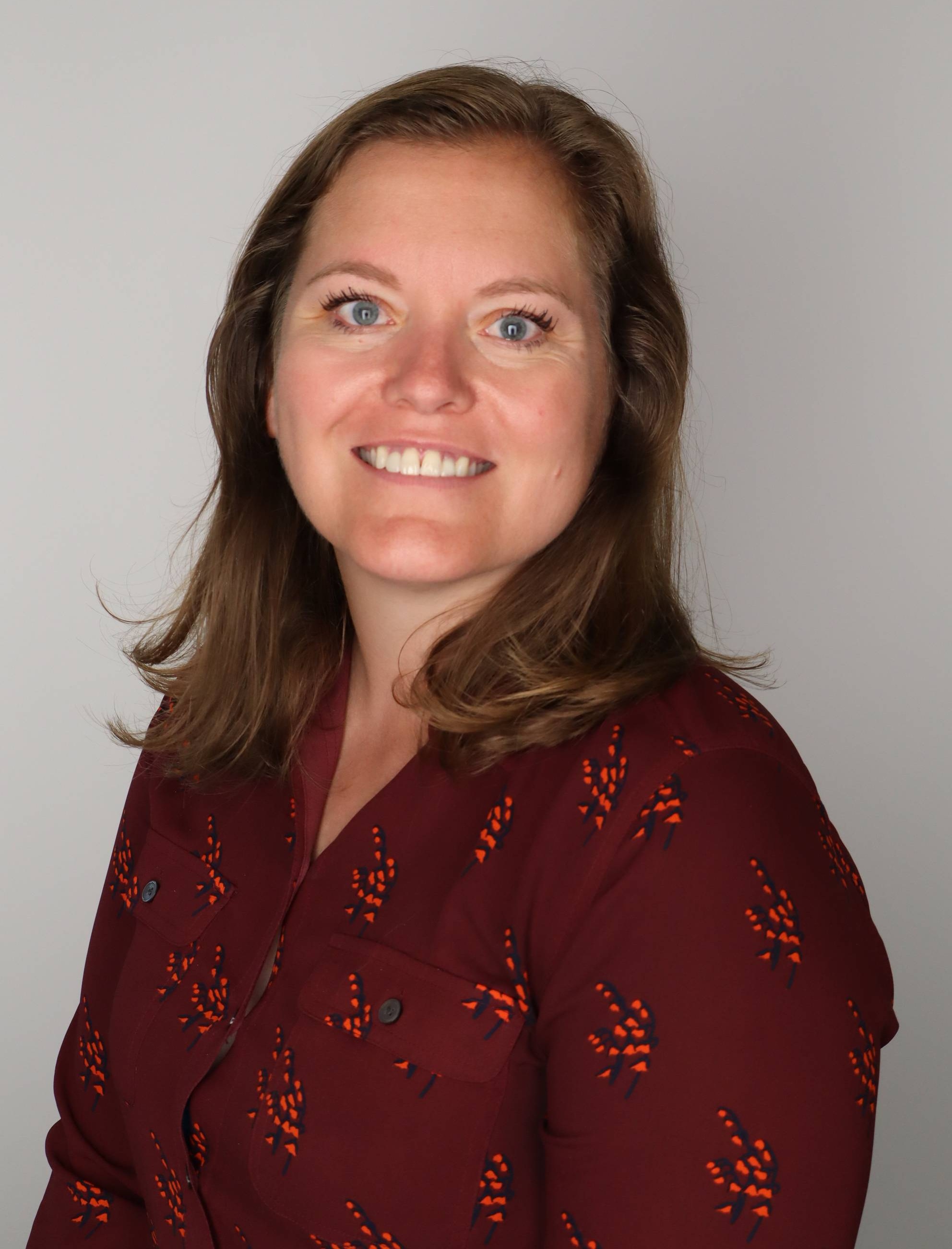 a career counselor smiles for a professional headshot