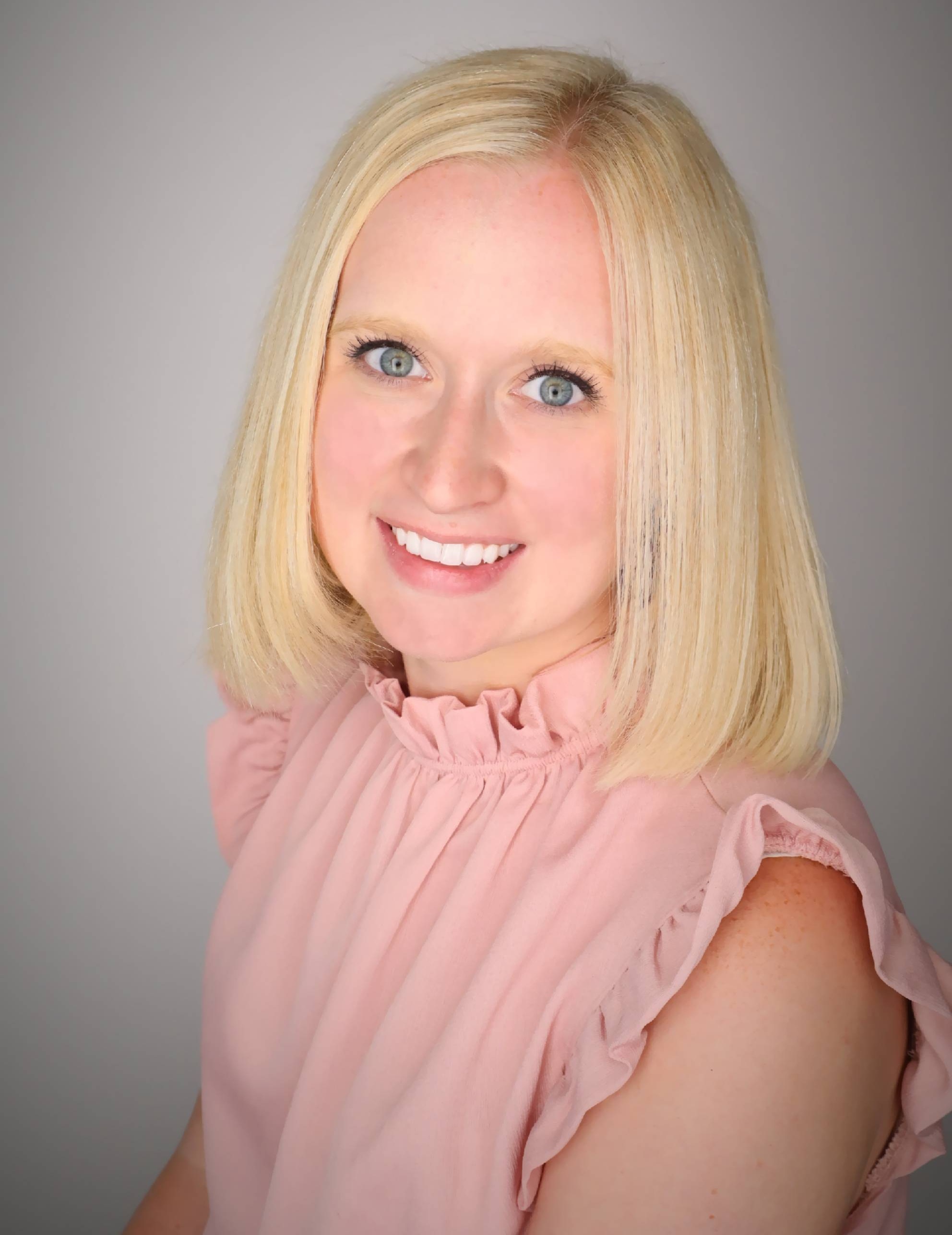 A career counselor smiles for a professional photo