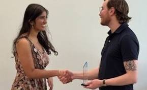Dr Capone gives Tania Mishra the Turing Award