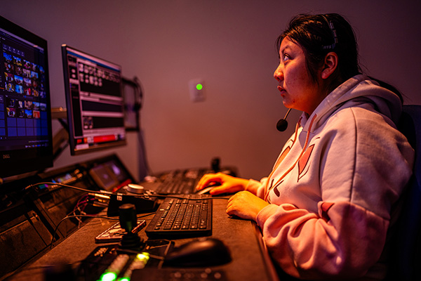 Student using film editing software