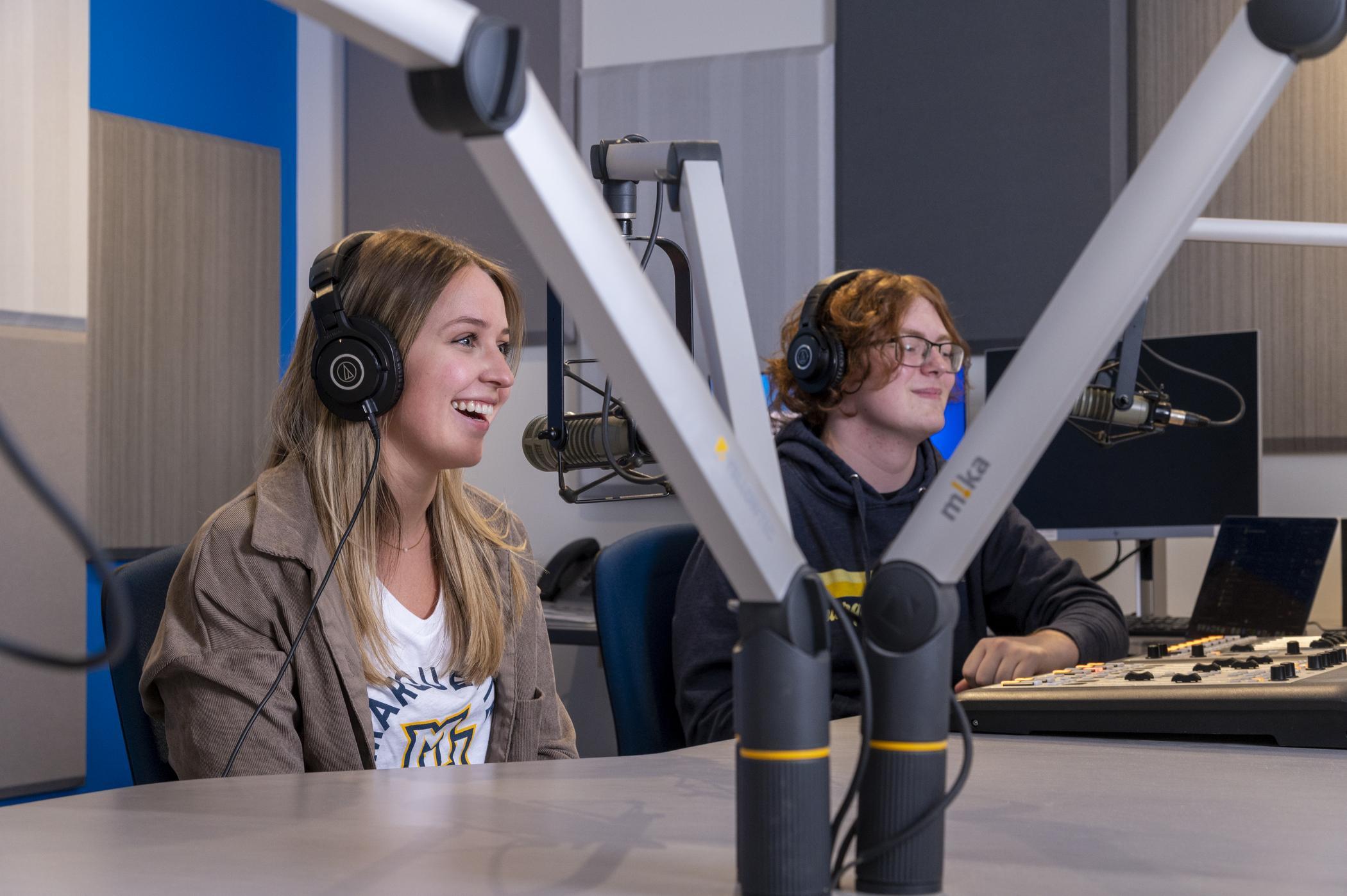 Two students in a recording studio