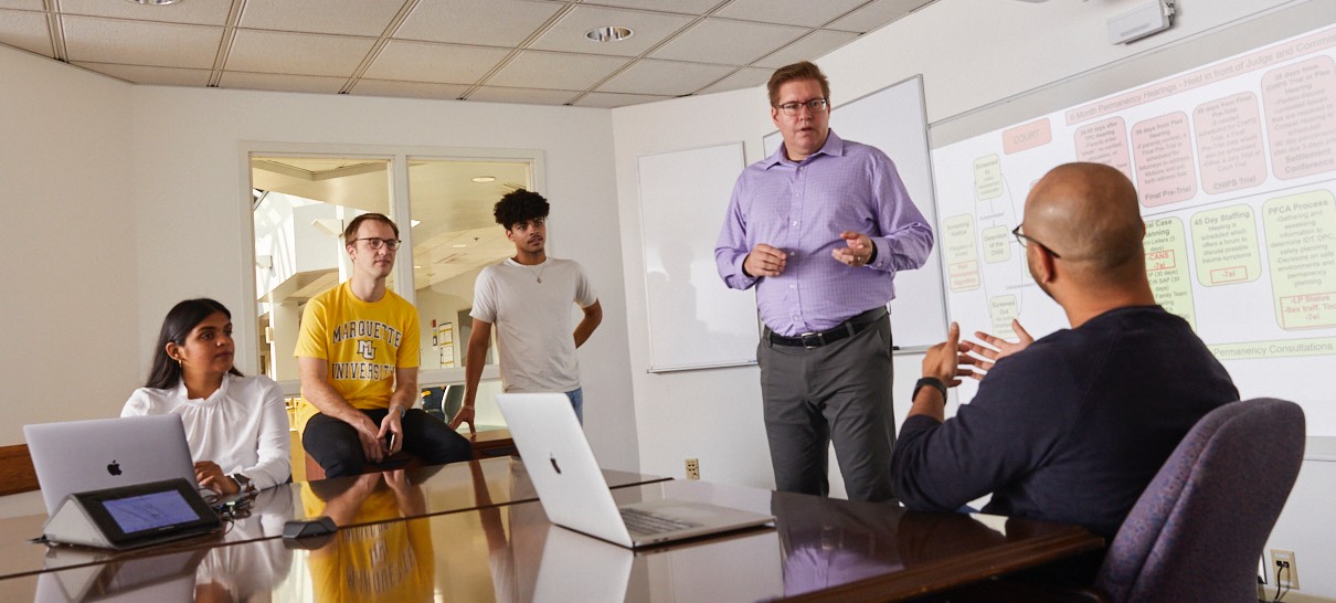 Michael Zimmer and students in discussion regarding Center for Data, Ethics, and Society