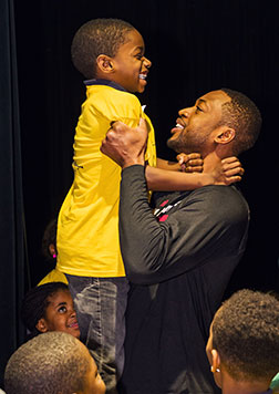 Dwayne Wade and children from the Hartman Literacy Center