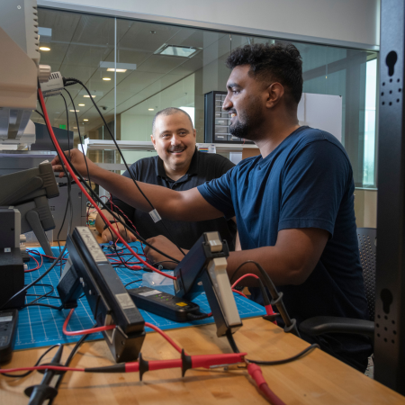 faculty member discussing work with graduate student