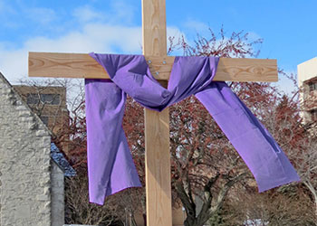 Snow-covered Lenten crucifix at St. Joan of Arc Chapel