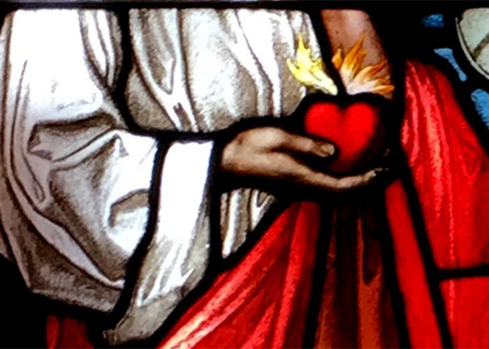 Heart representing the virtue of love in stained glass at Johnston Hall