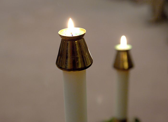 Lit candles at Gesu Church