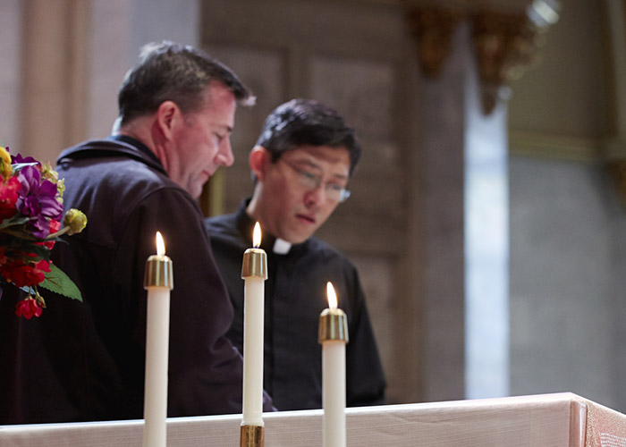 Two Jesuit priests at the altar