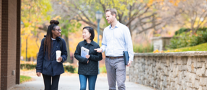 Graduate school educators with a degree in secondary education talking on campus