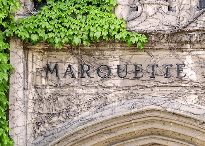 Marquette University text above door entrance with ivy