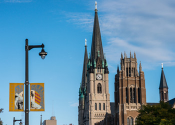 View of Wisconsin Avenue with Gesu Church and Marquette Hall