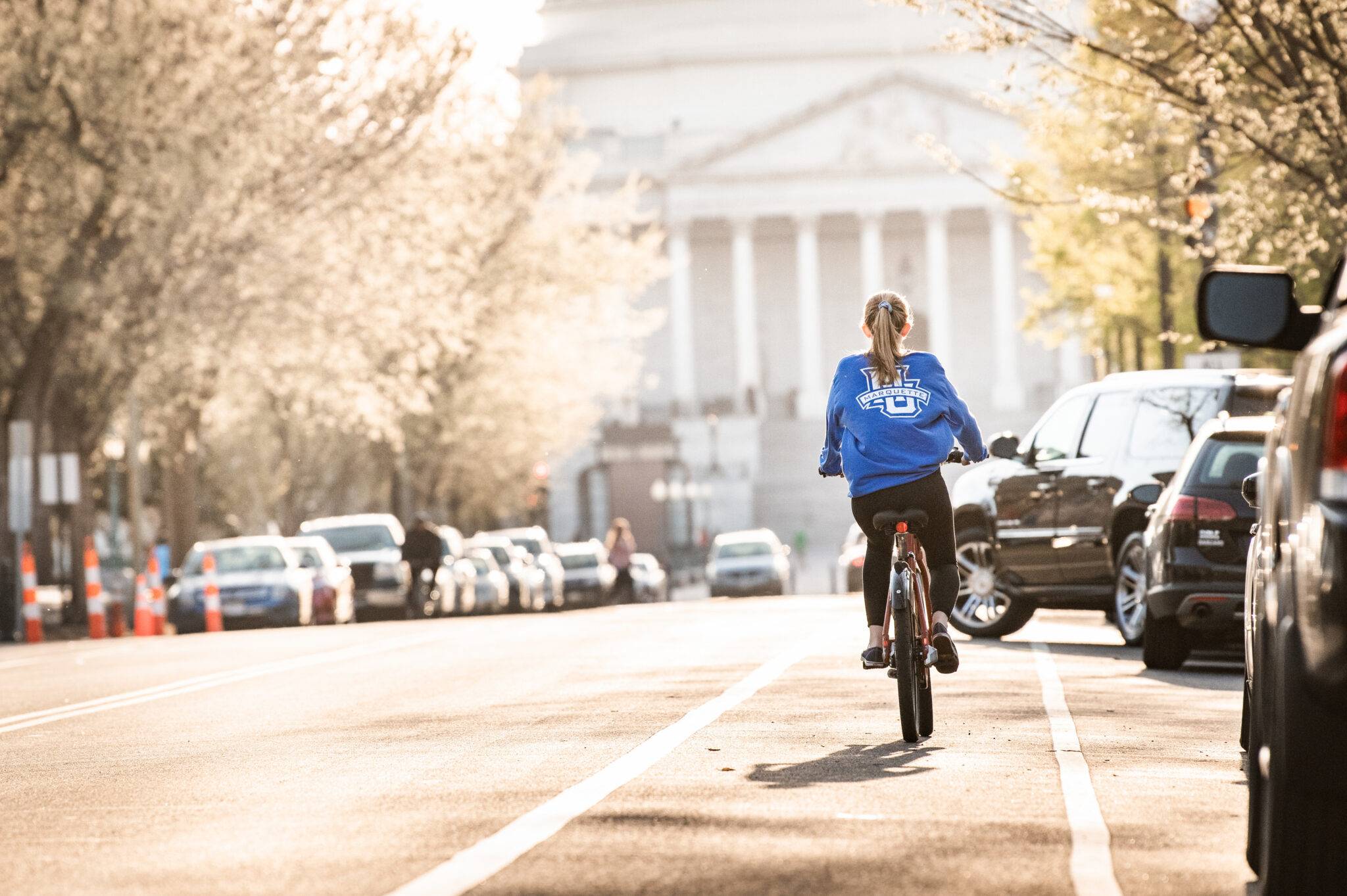 Marquette student bicycling in Washington, DC.