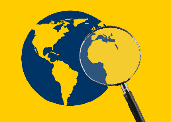 magnifying glass hovering over an image of a blue and gold globe