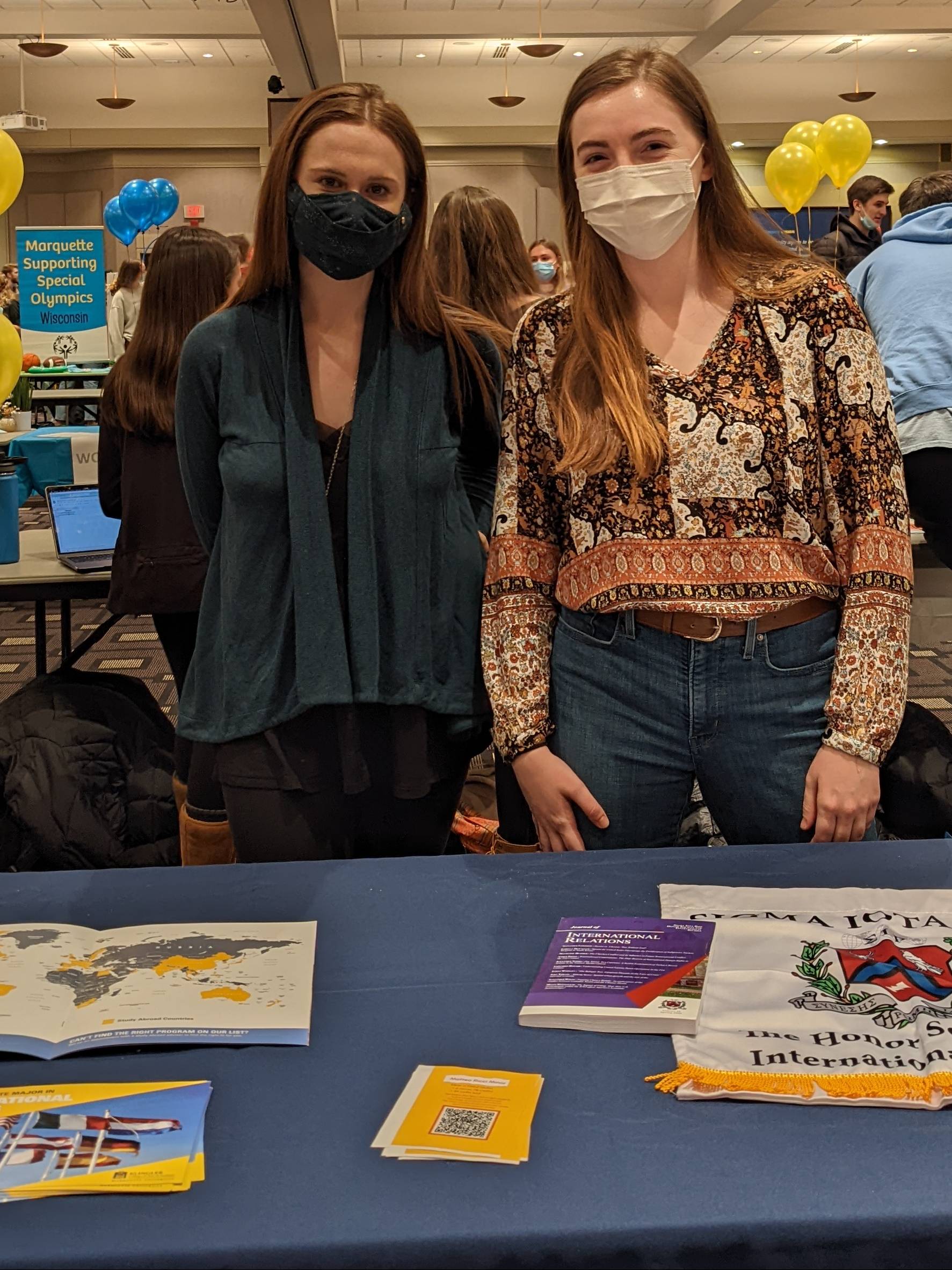 E-Board Member Kaley Gilbert and Katherine Walsh representing Sigma Iota Rho, the National Honor Society of International Affairs, at Winter O-Fest 2022.
