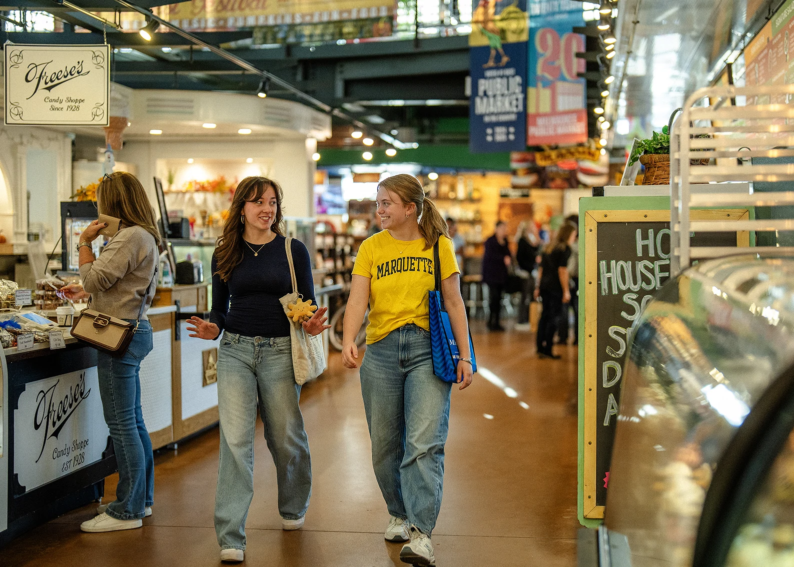 marquette students walking inside the milwaukee public market