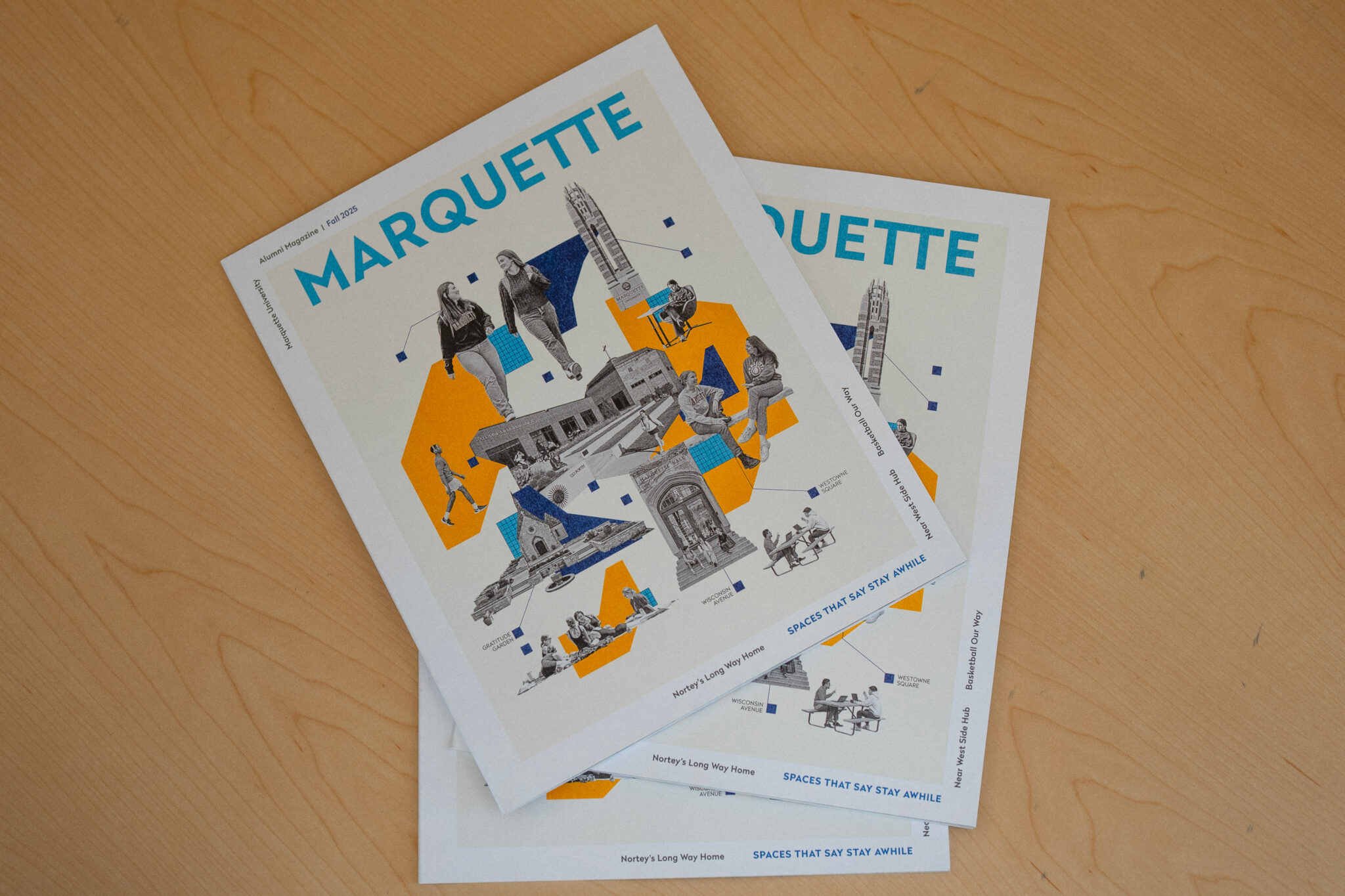 Issues of Marquette Magazine on a table