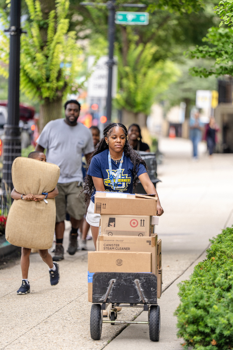 Student moving into a residence hall