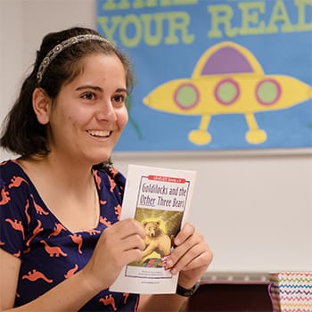 College of Education student holds a book