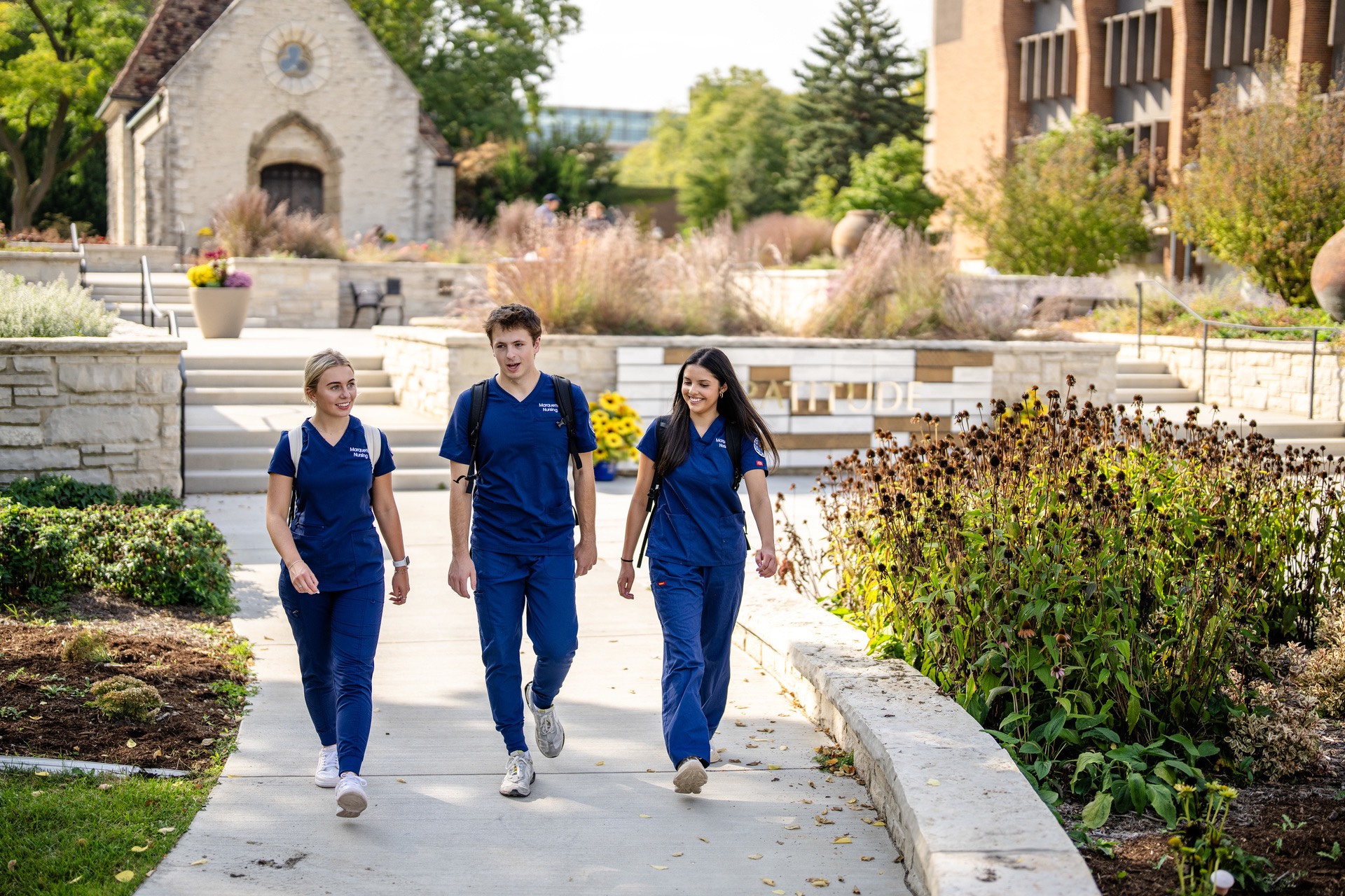 Nursing students walk near Joan of Arc Chapel.
