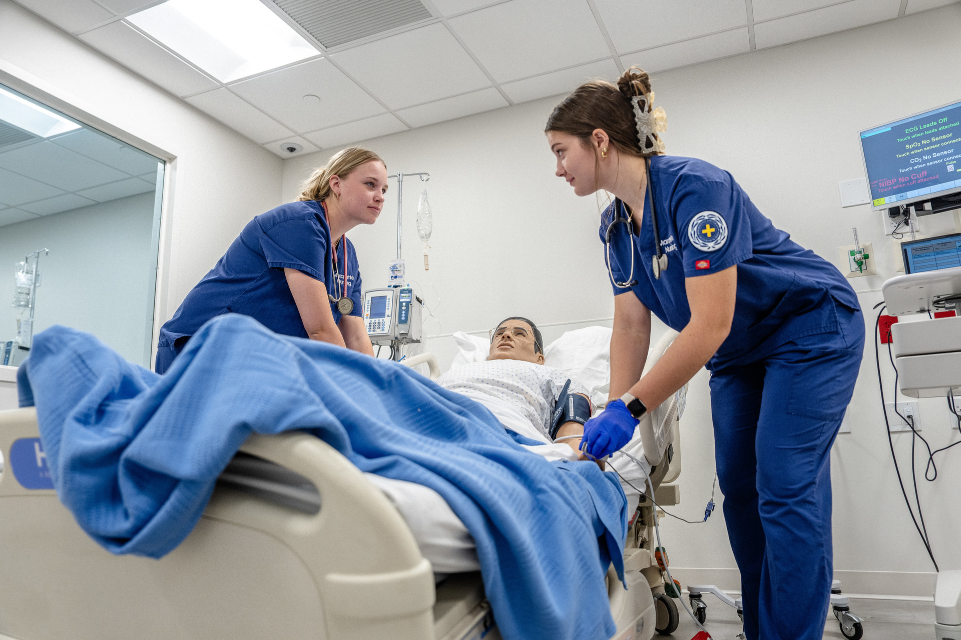 Multiple students engaging in simulation.