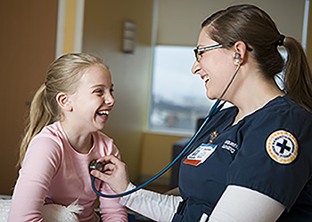 A Nursing student with a patient