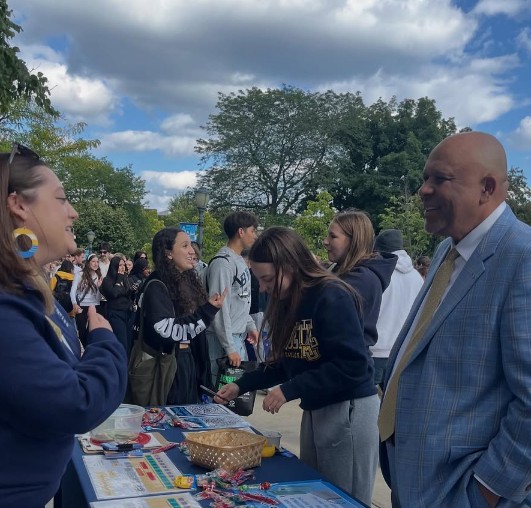 large crowd visiting tables