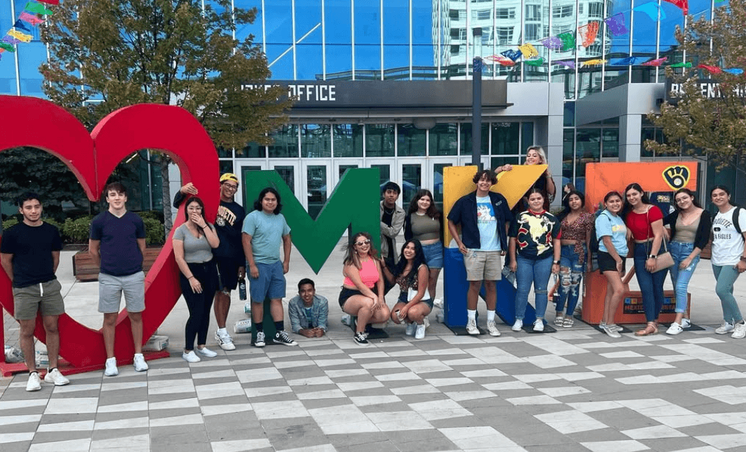 Nuestro Hogar students in front of MKE display