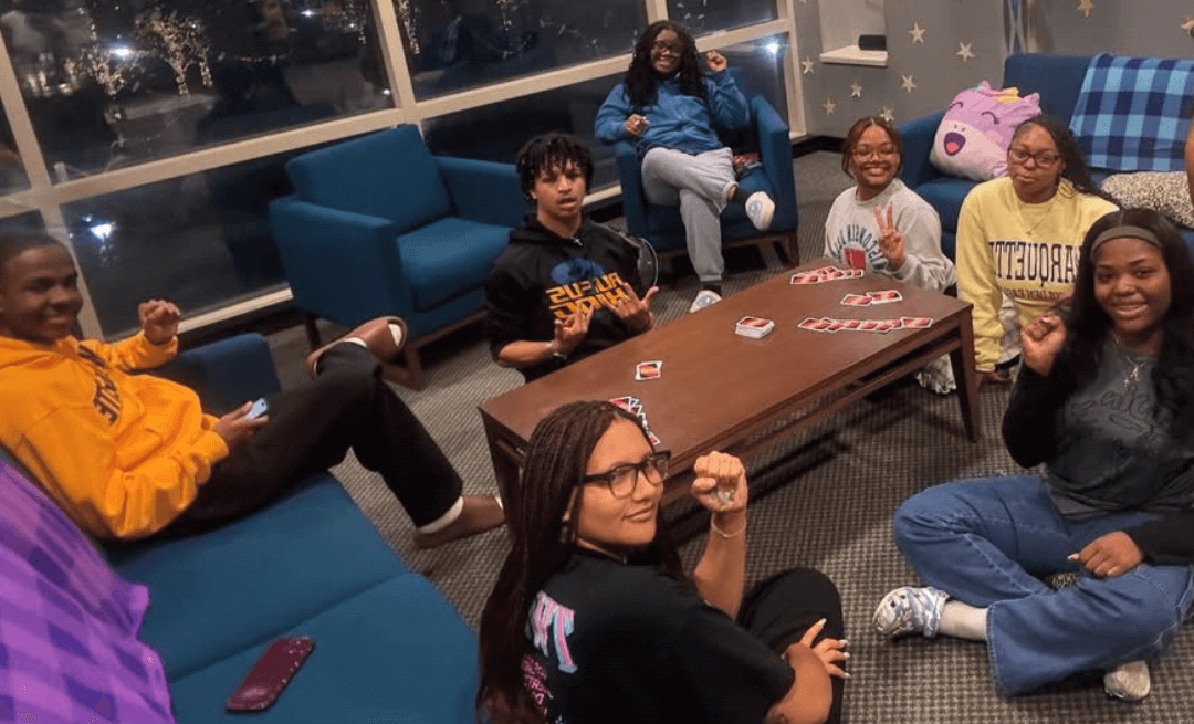 Umoja students playing a card game