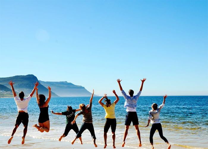 Students in on the beach in Cape Town, South Africa