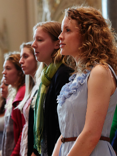 Students participating in a Mass service